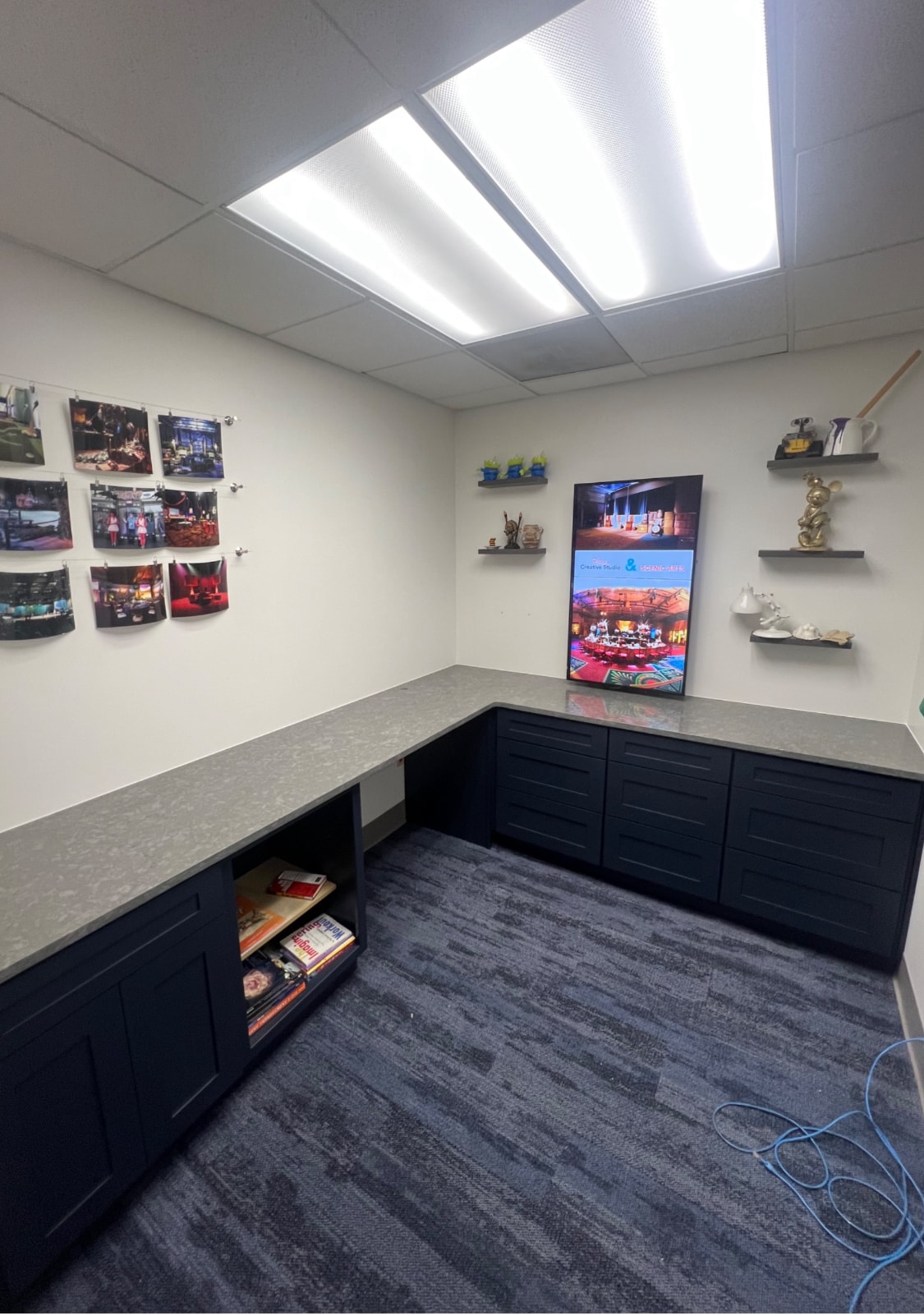 Dark navy shaker office built-in cabinetry with gray quartz countertop by 1 Stop Cabinets